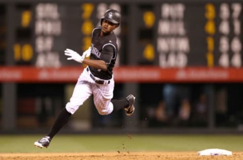 DENVER, CO – JUNE 21: Raimel Tapia #7 of the Colorado Rockies rounds second base after hitting a triple in the seventh inning against the Arizona Diamondbacks at Coors Field on June 21, 2017 in Denver, Colorado. (Photo by Matthew Stockman/Getty Images)