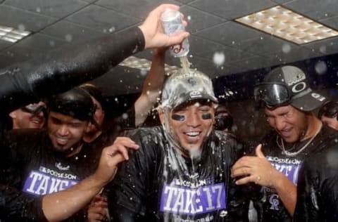 DENVER, CO – SEPTEMBER 30: Carlos Gonzalez #5 of the Colorado Rockies is doused by his teammates in the lockerroom at Coors Field on September 30, 2017 in Denver, Colorado. Although losing 5-3 to the Los Angeles Dodgers, the Rockies celebrated clinching a wild card spot in the post season. (Photo by Matthew Stockman/Getty Images)