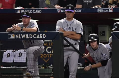 PHOENIX, AZ – OCTOBER 04: Manager Bud Black #10 of the Colorado Rockies (center) and bench coach Mike Redmond #11 watch the action during the first inning of the National League Wild Card game against the Arizona Diamondbacks at Chase Field on October 4, 2017 in Phoenix, Arizona. (Photo by Norm Hall/Getty Images)