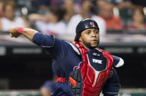 CLEVELAND, OH – JULY 9: Catcher Carlos Santana #41 of the Cleveland Indians throws out Jose Bautista #19 of the Toronto Blue Jays at Progressive Field on July 9, 2013 in Cleveland, Ohio. (Photo by Jason Miller/Getty Images)