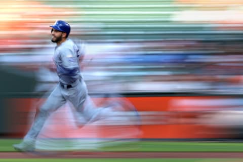 A slow shutter speed picture of Eric Hosmer running between first and second base. Getty Images.