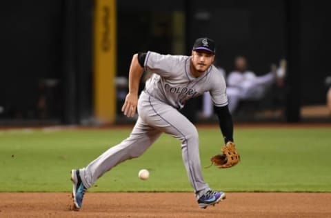 PHOENIX, AZ – SEPTEMBER 11: Nolan Arenado #28 of the Colorado Rockies makes a play on a ground ball hit by Brandon Drury #27 of the Arizona Diamondbacks during the fourth inning at Chase Field on September 11, 2017 in Phoenix, Arizona. Drury was forced out at first base. (Photo by Norm Hall/Getty Images)