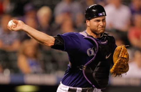 DENVER, CO – JUNE 13: Catcher Chris Iannetta #20 of the Colorado Rockies throws out Jason Bartlett #8 of the San Diego Padres on a sacrafice bunt at Coors Field on June 13, 2011 in Denver, Colorado. (Photo by Justin Edmonds/Getty Images)