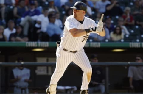 DENVER – SEPTEMBER 25: Larry Walker #33 of the Colorado Rockies looks for the rest of his bat as he grounds out against the Arizona Diamondbacks in the fifth inning September 25, 2003 at Coors Field in Denver, Colorado. The Diamondbacks won 8-7. (Photo by Brian Bahr/Getty Images)