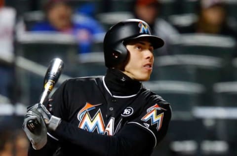 NEW YORK, NY – APRIL 07: Christian Yelich #21 of the Miami Marlins follows through on his third inning two run home run against the New York Mets at Citi Field on April 7, 2017 in the Flushing neighborhood of the Queens borough of New York City. (Photo by Jim McIsaac/Getty Images)