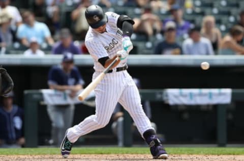 DENVER, CO – JULY 19: Nolan Arenado #28 of the Colorado Rockies hits a home run in the fourth inning against the San Diego Padres at Coors Field on July 19, 2017 in Denver, Colorado. (Photo by Matthew Stockman/Getty Images)