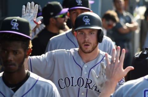 LOS ANGELES, CA – SEPTEMBER 10: Trevor Story #27 of the Colorado Rockies is greeted in the dugout after a solo home run in the ninth inning of the game against the Los Angeles Dodgers at Dodger Stadium on September 10, 2017 in Los Angeles, California. (Photo by Jayne Kamin-Oncea/Getty Images)