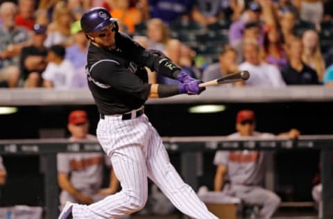 DENVER, CO – JUNE 23: Troy Tulowitzki #2 of the Colorado Rockies takes an at bat against the Arizona Diamondbacks at Coors Field on June 23, 2015 in Denver, Colorado. The Rockies defeated the Diamondbacks 10-5. (Photo by Doug Pensinger/Getty Images)