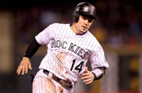 DENVER, CO – APRIL 21: Tony Wolters #14 of the Colorado Rockies rounds third base to score on a 2 run inside the park home run hit by Charlie Blackmon in the fourth inning against the San Francisco Giants at Coors Field on April 21, 2017 in Denver, Colorado. (Photo by Matthew Stockman/Getty Images)