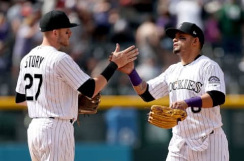 DENVER, CO – APRIL 23: Trevor Story #27 and Gerardo Parra #8 of the Colorado Rockies celebrate their win over the San Francisco Giants at Coors Field on April 23, 2017 in Denver, Colorado. (Photo by Matthew Stockman/Getty Images)