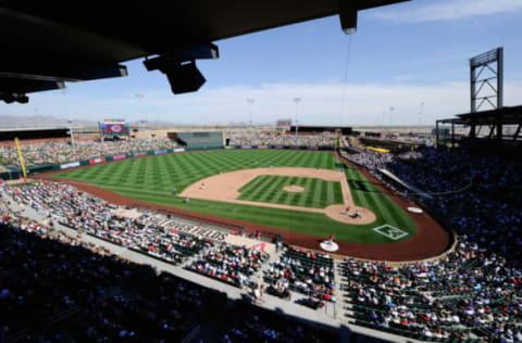 SCOTTSDALE, AZ – MARCH 14: Fans follow the action on the baseball diamond between the Cincinnati Reds and the Colorodo Rockis during the spring training baseball game at Salt River Fields at Talking Stick on March 14, 2011 in Scottsdale, Arizona. (Photo by Kevork Djansezian/Getty Images)