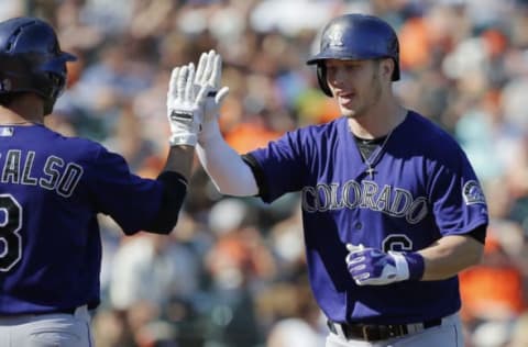 SAN FRANCISCO, CA – OCTOBER 4: Corey Dickerson #6 of the Colorado Rockies celebrates a 374-foot home run to tie the game 3-3 against the San Francisco Giants with Daniel Descalso #3 in the ninth inning at AT&T Park on October 4, 2015 in San Francisco, California, during the final day of the regular season. The Rockies won 7-3. (Photo by Brian Bahr/Getty Images)