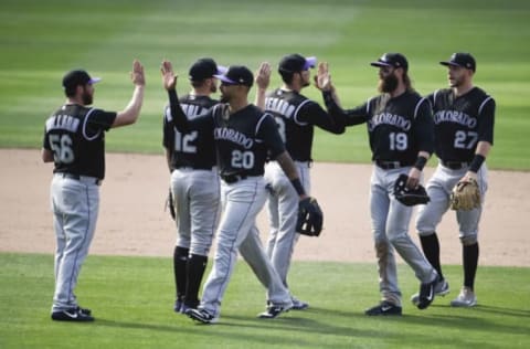 SAN DIEGO, CA – MAY 4: Colorado Rockies players high-five after beating the San Diego Padres 3-2 in 11 innings at PETCO Park on May 4, 2017 in San Diego, California. (Photo by Denis Poroy/Getty Images)