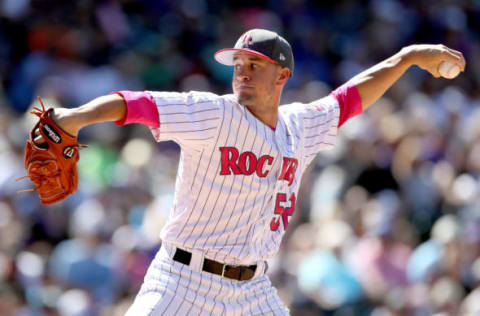 DENVER, CO – MAY 14: Pitcher Chris Rusin #52 of the Colorado Rockies throws in the sixth inning against the Los Angeles Dodgers at Coors Field on May 14, 2017 in Denver, Colorado. Members of both teams were wearing pink in commemoration of Mother’s Day weekend. (Photo by Matthew Stockman/Getty Images)