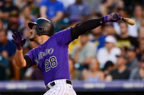 DENVER, CO – AUGUST 18: Nolan Arenado #28 of the Colorado Rockies follows the flight of a third inning triple against the Milwaukee Brewers at Coors Field on August 18, 2017 in Denver, Colorado. (Photo by Dustin Bradford/Getty Images)