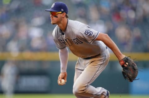 DENVER, CO – SEPTEMBER 17: Wil Myers #4 of the San Diego Padres fields a ground ball during a regular season MLB game between the Colorado Rockies and the visiting San Diego Padres at Coors Field on September 17, 2017 in Denver, Colorado. (Photo by Russell Lansford/Getty Images)