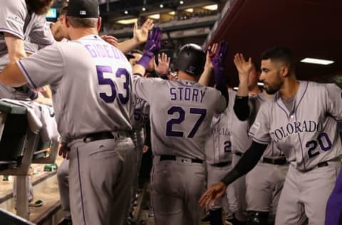 PHOENIX, AZ – OCTOBER 04: Trevor Story #27 of the Colorado Rockies reacts with teammates after hitting a solo home run during the top of the eighth inning of the National League Wild Card game against the Arizona Diamondbacks at Chase Field on October 4, 2017 in Phoenix, Arizona. (Photo by Christian Petersen/Getty Images)