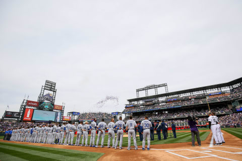 DENVER, CO – APRIL 7: The Los Angeles Dodgers and Colorado Rockies stand on the field before the opening day game at Coors Field on April 7, 2017 in Denver, Colorado. (Photo by Justin Edmonds/Getty Images)