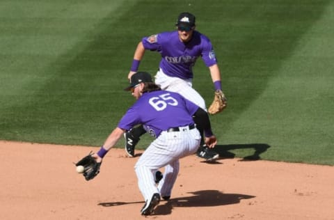 SCOTTSDALE, AZ – FEBRUARY 27: Brendan Rodgers #65 of the Colorado Rockies makes a play on a ground ball in the seventh inning against the Los Angeles Angels of Anaheim during a Spring Training game at Salt River Fields at Talking Stick on February 27, 2018 in Scottsdale, Arizona. (Photo by Norm Hall/Getty Images)