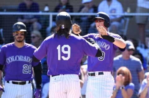 SCOTTSDALE, AZ – MARCH 05: Charlie Blackmon #19 of the Colorado Rockies is congratulated by teammate DJ LeMahieu #9 after hitting a two run home run during the first inning of a spring training game against the Chicago Cubs at Salt River Fields at Talking Stick on March 5, 2018 in Scottsdale, Arizona. (Photo by Norm Hall/Getty Images)