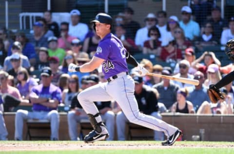 SCOTTSDALE, AZ – MARCH 12: Ryan McMahon #24 of the Colorado Rockies follows through on a swing during the second inning of a spring training game against the Arizona Diamondbacks at Salt River Fields at Talking Stick on March 12, 2018 in Scottsdale, Arizona. (Photo by Norm Hall/Getty Images)