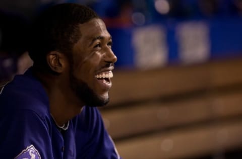 DENVER, CO – JULY 20: Dexter Fowler #24 of the Colorado Rockies smiles in the dugout after scoring in the eighth inning against the Chicago Cubs at Coors Field on July 20, 2013 in Denver, Colorado. The Rockies defeated the Cubs 9-3. (Photo by Justin Edmonds/Getty Images)