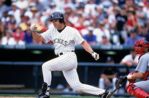 25 Jul 1999: Dante Bichette #10 of the Colorado Rockies drops his bat during the game against the St. Louis Cardinals at the Coors Field in Denver, Colorado. The Cardinals defeated the Rockies 10-6. Credit: Brian Bahr/Allsport (Getty Images)