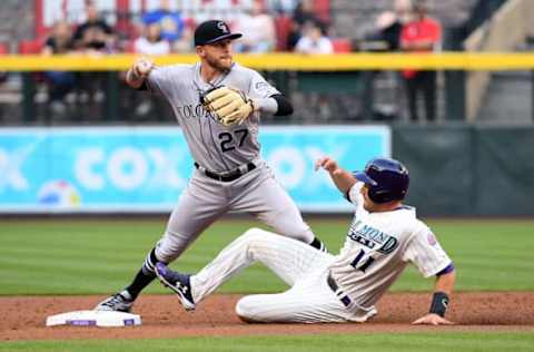 PHOENIX, AZ – MARCH 31: Trevor Story #27 of the Colorado Rockies makes the force out on A.J. Pollock #11 of the Arizona Diamondbacks in the first inning of the MLB game at Chase Field on March 31, 2018 in Phoenix, Arizona. (Photo by Jennifer Stewart/Getty Images)