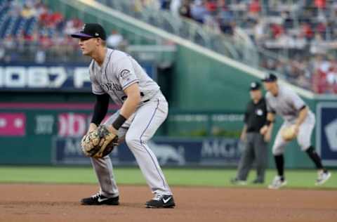 WASHINGTON, DC – APRIL 13: First baseman Ryan McMahon #24 of the Colorado Rockies follows the ball against the Washington Nationals at Nationals Park on April 13, 2018 in Washington, DC. (Photo by Rob Carr/Getty Images)