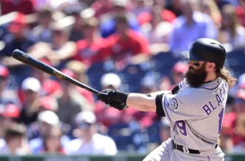 WASHINGTON, DC – APRIL 14: Charlie Blackmon #19 of the Colorado Rockies hits a two-run home run in the first inning against the Washington Nationals at Nationals Park on April 14, 2018 in Washington, DC. (Photo by Patrick McDermott/Getty Images)