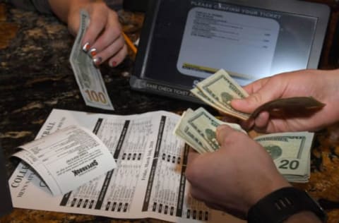 LAS VEGAS, NV – MARCH 15: Jake Sindberg of Wisconsin makes bets during a viewing party for the NCAA Men’s College Basketball Tournament inside the 25,000-square-foot Race & Sports SuperBook at the Westgate Las Vegas Resort & Casino which features 4,488-square-feet of HD video screens on March 15, 2018 in Las Vegas, Nevada. (Photo by Ethan Miller/Getty Images)