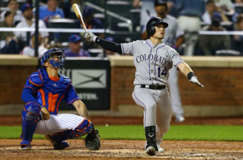 NEW YORK, NY – MAY 04: Tony Wolters #14 of the Colorado Rockies connects on a solo home run in the sixth inning against the New York Mets at Citi Field on May 4, 2018 in the Flushing neighborhood of the Queens borough of New York City. (Photo by Mike Stobe/Getty Images)