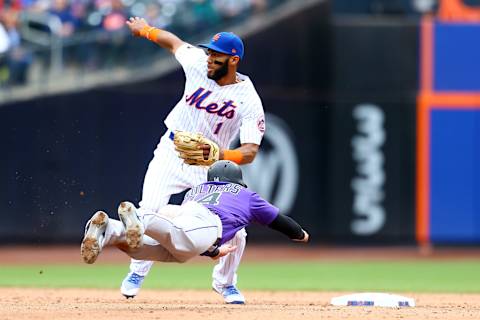 NEW YORK, NY – MAY 06: Tony Wolters #14 of the Colorado Rockies steals second base as Amed Rosario #1 of the New York Mets looks on at Citi Field on May 6, 2018 in the Flushing neighborhood of the Queens borough of New York City. (Photo by Mike Stobe/Getty Images)