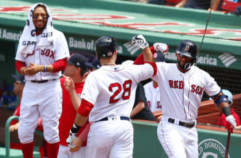 BOSTON, MA – MAY 20: J.D. Martinez #28 of the Boston Red Sox high fives Eduardo Nunez #36 after hitting a solo home run in the second inning of a game against the Baltimore Orioles at Fenway Park on May 20, 2018 in Boston, Massachusetts. (Photo by Adam Glanzman/Getty Images)