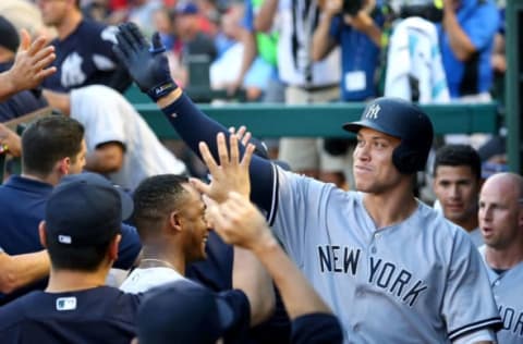 ARLINGTON, TX – MAY 23: Aaron Judge #99 of the New York Yankees gets high fives in the dugout after a two run home run in the fifth inning against the Texas Rangers at Globe Life Park in Arlington on May 23, 2018 in Arlington, Texas. (Photo by Richard Rodriguez/Getty Images)