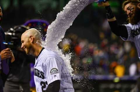 DENVER, CO – MAY 28: Chris Iannetta #22 of the Colorado Rockies receives an ice bath from Charlie Blackmon #19 of the Colorado Rockies after hitting a 10th inning walk-off single against the San Francisco Giants at Coors Field on May 28, 2018 in Denver, Colorado. (Photo by Dustin Bradford/Getty Images)