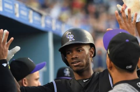 LOS ANGELES, CA – JUNE 23: Raimel Tapia #7 of the Colorado Rockies is greeted in the dugout after scoring a run in the second inning of the game against the Los Angeles Dodgers at Dodger Stadium on June 23, 2017 in Los Angeles, California. (Photo by Jayne Kamin-Oncea/Getty Images)