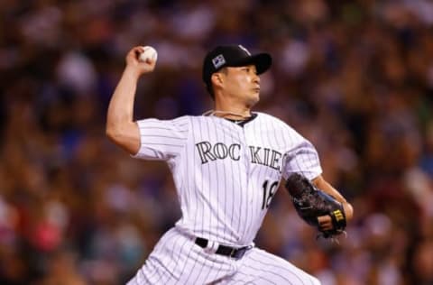 DENVER, CO – JULY 28: Seunghwan Oh #18 of the Colorado Rockies delivers to home plate against the Oakland Athletics during the seventh inning of interleague play at Coors Field on July 28, 2018 in Denver, Colorado. (Photo by Justin Edmonds/Getty Images)