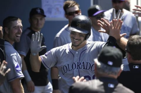 LOS ANGELES, CA – JULY 01: Nolan Arenado #28 of the Colorado Rockies is congratulated on his fifth inning home run against the Los Angeles Dodgers at Dodger Stadium on July 1, 2018 in Los Angeles, California. (Photo by John McCoy/Getty Images)