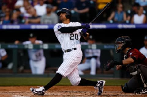 DENVER, CO – JULY 11: Ian Desmond #20 of the Colorado Rockies hits a three-run home run as catcher Alex Avila #5 of the Arizona Diamondbacks looks on during the first inning at Coors Field on July 11, 2018 in Denver, Colorado. (Photo by Justin Edmonds/Getty Images)