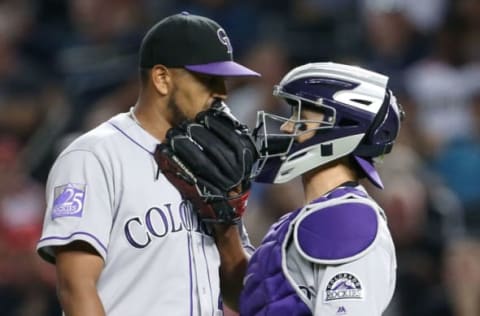 PHOENIX, AZ – JULY 20: Starting pitcher German Marquez #48 of the Colorado Rockies talks with catcher Tony Wolters #14 during a mound visit in the first inning of an MLB game against the Arizona Diamondbacks at Chase Field on July 20, 2018 in Phoenix, Arizona. (Photo by Ralph Freso/Getty Images)