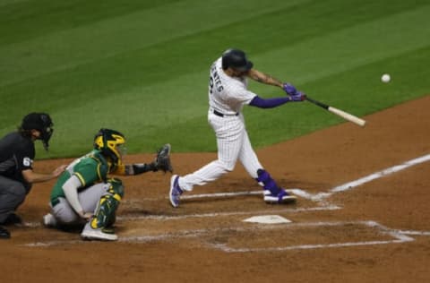 DENVER, CO – SEPTEMBER 15: Josh Fuentes #8 of the Colorado Rockies hits an RBI sacrifice fly during the sixth inning against the Oakland Athletics at Coors Field on September 15, 2020 in Denver, Colorado. (Photo by Justin Edmonds/Getty Images)