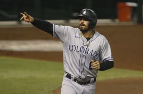 PHOENIX, ARIZONA – SEPTEMBER 26: Josh Fuentes #8 of the Colorado Rockies gestures toward the stands after scoring a run against the Arizona Diamondbacks on an RBI single by Daniel Murphy #9 during the fourth inning of the MLB game at Chase Field on September 26, 2020 in Phoenix, Arizona. (Photo by Ralph Freso/Getty Images)