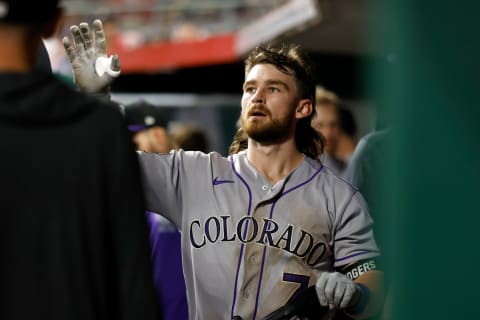 CINCINNATI, OH – JUNE 11: Brendan Rodgers #7 of the Colorado Rockies is congratulated by his teammates after scoring a run during the game against the Cincinnati Reds at Great American Ball Park on June 11, 2021 in Cincinnati, Ohio. Cincinnati defeated Colorado 11-5. (Photo by Kirk Irwin/Getty Images)