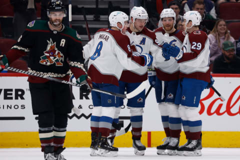 GLENDALE, ARIZONA – JANUARY 15: Mikko Rantanen #96 of the Colorado Avalanche celebrates with Cale Makar #8, Gabriel Landeskog #92 and Nathan MacKinnon #29 after Rantanen scored a goal against the Arizona Coyotes during the second period of the NHL game at Gila River Arena on January 15, 2022 in Glendale, Arizona. (Photo by Christian Petersen/Getty Images)