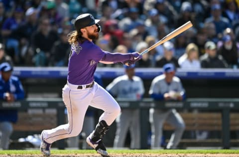 DENVER, CO - APRIL 10: Brendan Rodgers #7 of the Colorado Rockies hits an RBI sacrifice fly in the fourth inning of a game against the Los Angeles Dodgers at Coors Field on April 10, 2022 in Denver, Colorado. (Photo by Dustin Bradford/Getty Images)