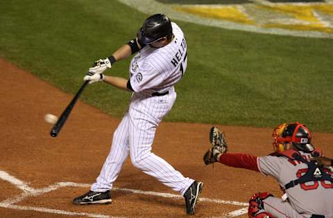 DENVER – OCTOBER 28: Todd Helton #17 of the Colorado Rockies htis a double against the Boston Red Sox in the second inning of Game Four of the 2007 Major League Baseball World Series at Coors Field on October 28, 2007 in Denver, Colorado. (Photo by Jonathan Daniel/Getty Images)