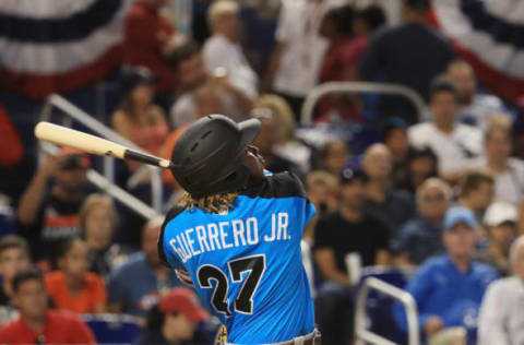 MIAMI, FL – JULY 09: Vladimir Guerrero Jr. #27 of the Toronto Blue Jays and the World Team swings at a pitch against the U.S. Team during the SiriusXM All-Star Futures Game at Marlins Park on July 9, 2017 in Miami, Florida. (Photo by Mike Ehrmann/Getty Images)