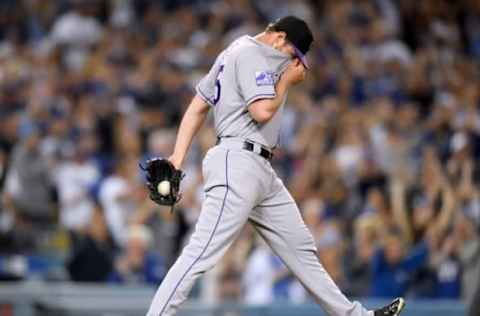 LOS ANGELES, CA – SEPTEMBER 19: Scott Oberg #45 of the Colorado Rockies reacts after giving up a three run homerun to Yasiel Puig #66 of the Los Angeles Dodgers, for a 5-2 Dodger lead, during the seventh inning at Dodger Stadium on September 19, 2018 in Los Angeles, California. (Photo by Harry How/Getty Images)