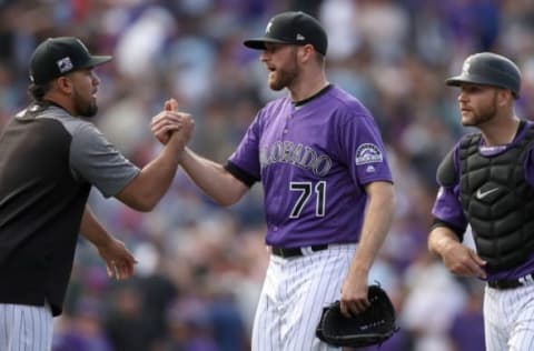 DENVER, CO – SEPTEMBER 27: Pitcher Wade Davis of the Colorado Rockies is congratulated by Antonio Senzatela after throwing a Rockies club record 42nd save against the Philadelphia Phillies at Coors Field on September 27, 2018 in Denver, Colorado. (Photo by Matthew Stockman/Getty Images)